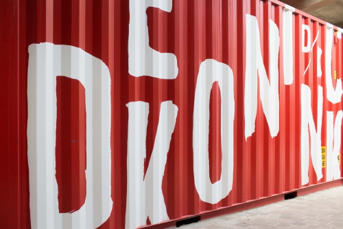 Container with typography branding for Antwerp city brewery DeKoninck