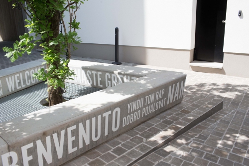 Concrete bench with typography for DeKoninck Antwerp city brewery