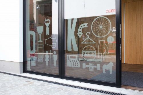 Window stickers and wayfinding design for Antwerp city brewery DeKoninck